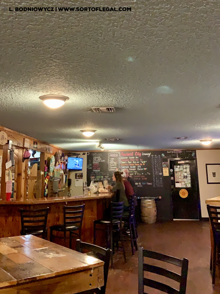 Interior bar at Ancient City Brewing in St. Augustine, Florida.  George Bodniowycz making new friends.