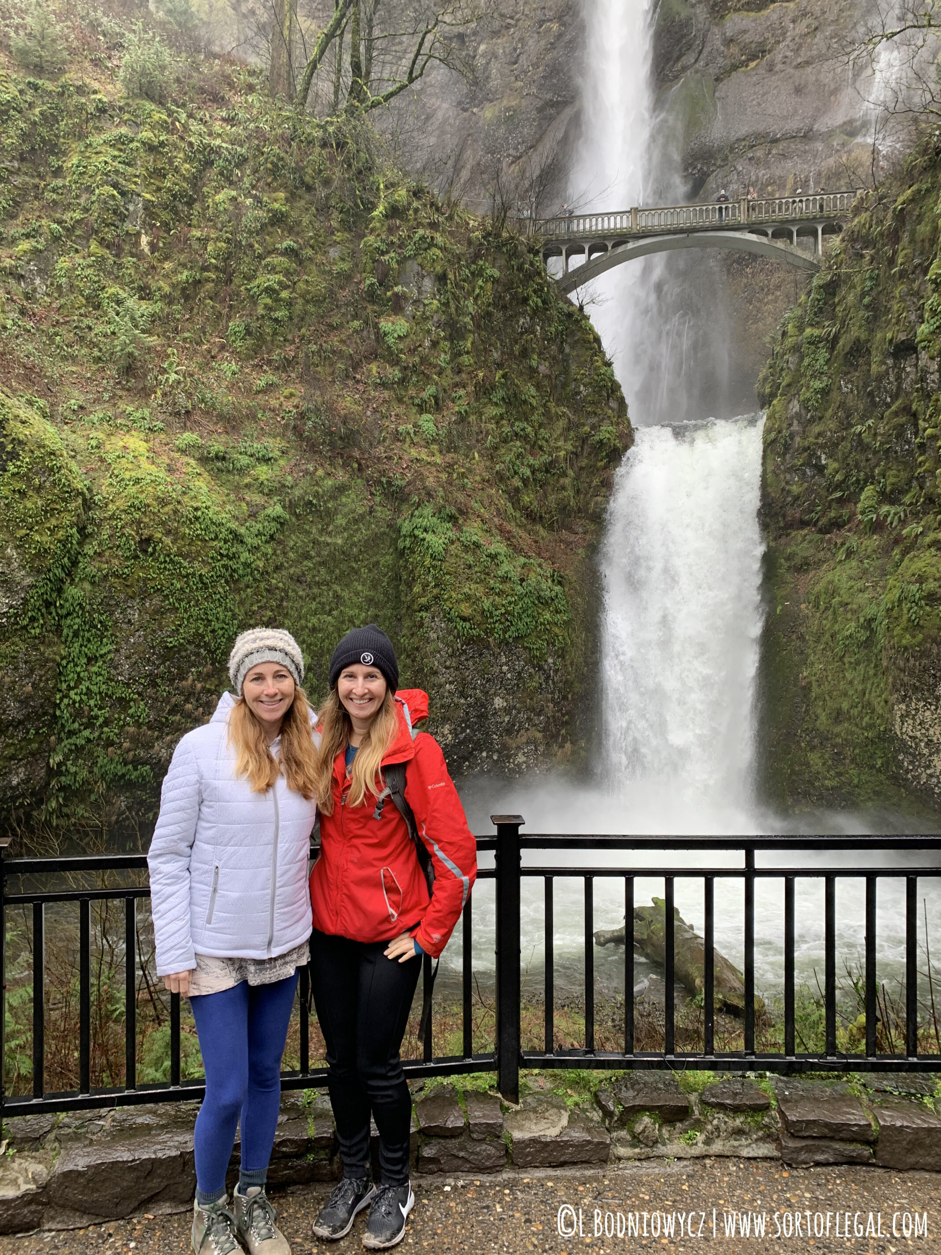 Two Friends at Multnomah Falls in Winter Oregon